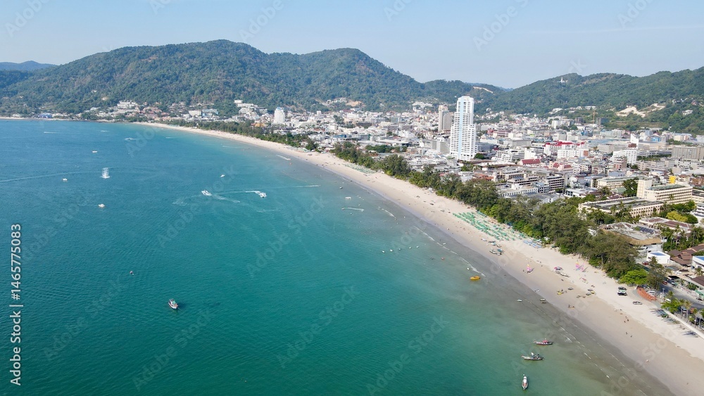 Fototapeta premium Coastal cityscape with beach and mountains 