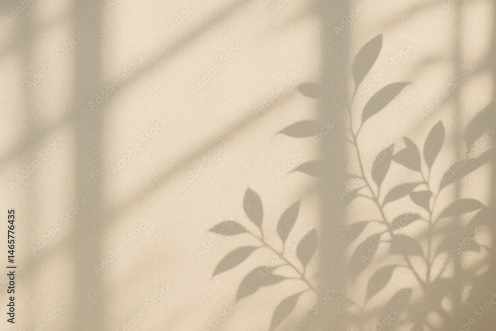 Illuminated by soft window light, a light beige wall showcases gentle shadows of leaves and window frames, creating a serene and minimalist atmosphere perfect for tranquil interiors
