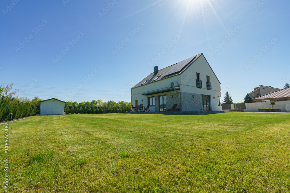 Perfectly cut lawn in the fully detached new build house garden