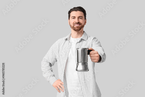 Young man with geyser coffe...
