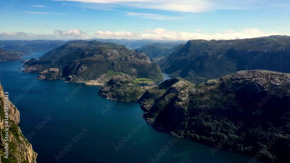 Panoramic View of Fjord Landscape with Rugged Mountains and Deep Water Channel Panoramic View of Fjord Landscape with Rugged Mountains and Deep Water Channel