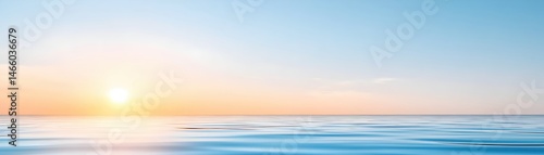 Soft Morning Light Over Still Ocean Under Clear Blue Sky