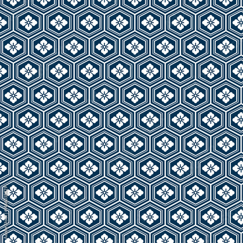 Hanabishi Kikko Japanese seamless pattern. Traditional hexagon and floral motif background in navy blue. Repeating geometric textile design for fabric, print, and decorative use