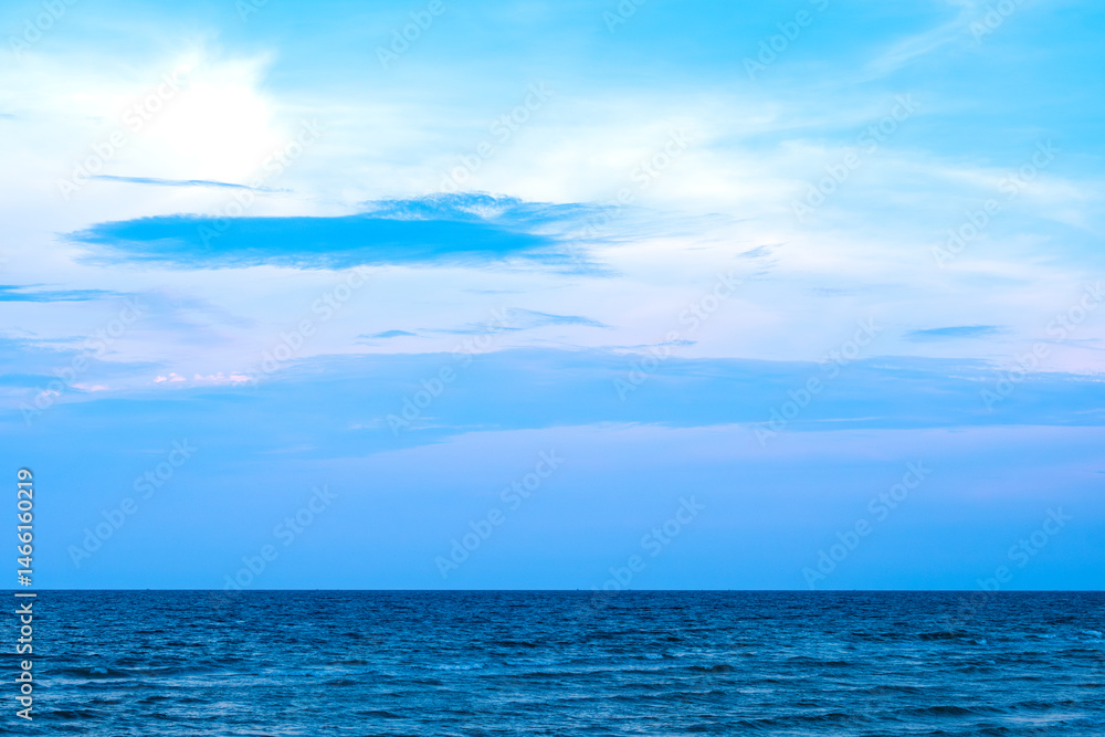 Fototapeta premium Nature of the ocean and blue sky Summer with sunshine, sandy beaches, clear blue waters sparkling against the blue sky. on an island with good ecology and environment Background for summer vacation