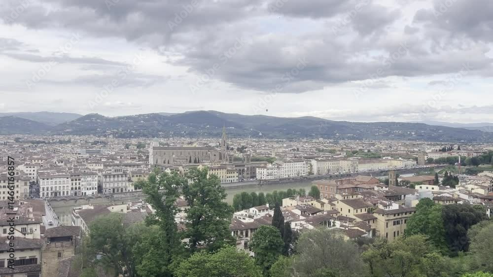 Balloon flying in the distance over Florence city in cloudy day Balloon flying in the distance over Florence city in cloudy day