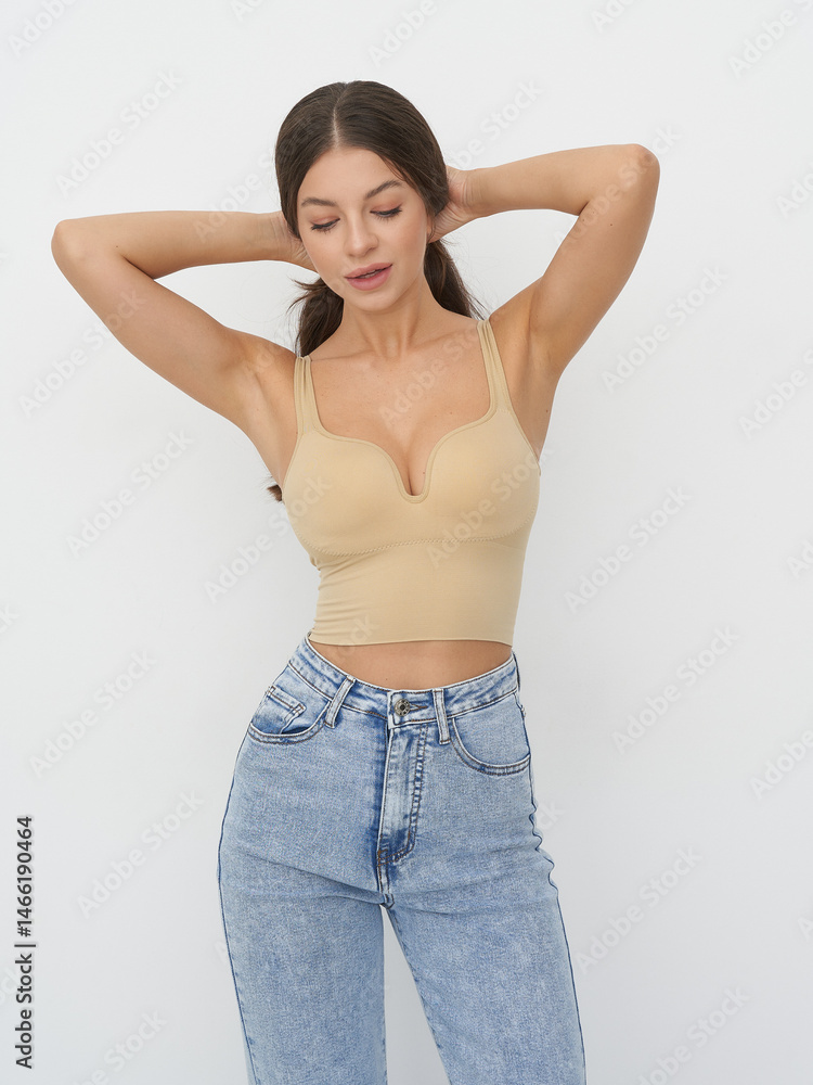 Model showcasing contemporary fashion in studio setting with elegant pose and style Model showcasing contemporary fashion in studio setting with elegant pose and style