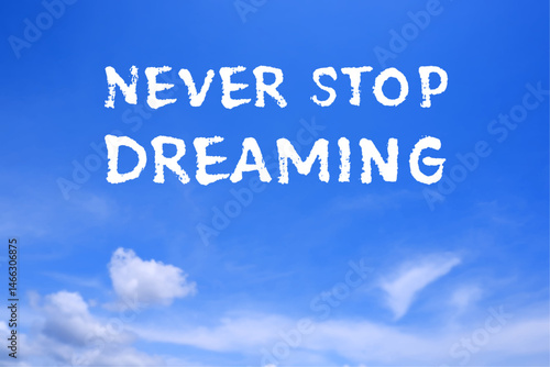 Never Stop Dreaming, text words typography in the blue sky, life and business motivatiobal inspirational concept
