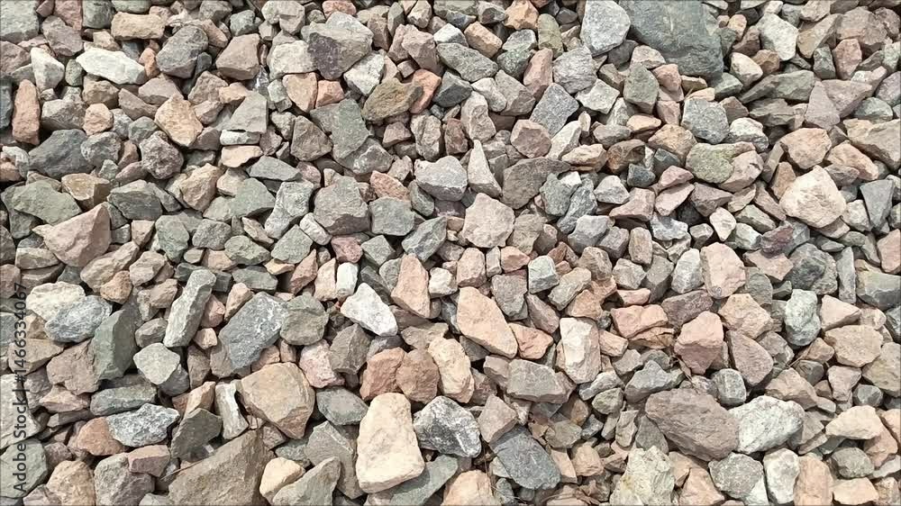 A pile of rubble in the sunlight. Stone background. Decorative stone for the garden. Rocks on the seashore. A pile of rubble in the sunlight. Stone background. Decorative stone for the garden. Rocks on the seashore.