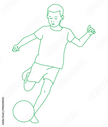 Boy kicking soccer ball at sports field on sunny day