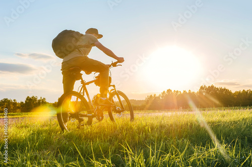 Man riding bicycle in countryside