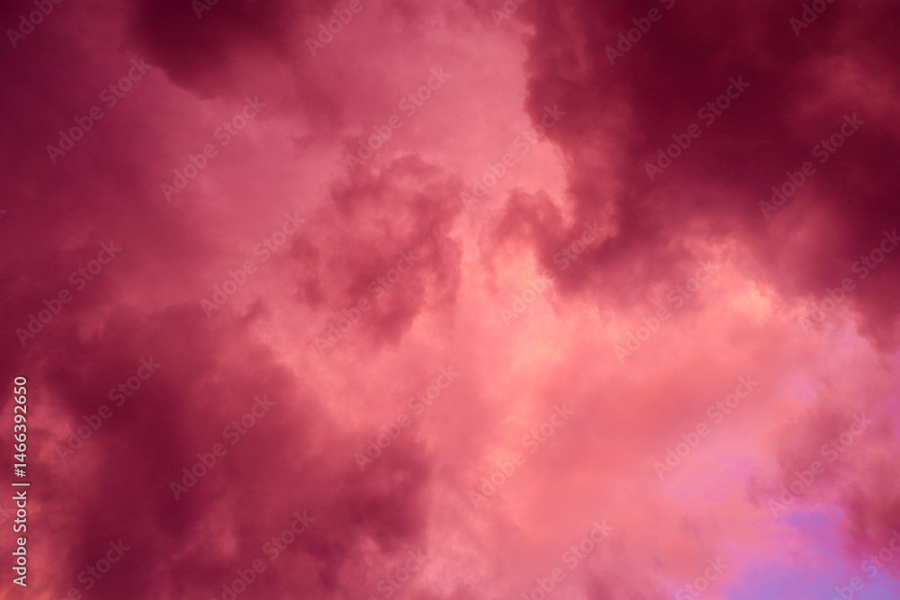Obraz premium Fiery red storm clouds with dramatic lighting. Red storm clouds background. Dramatic red sky.