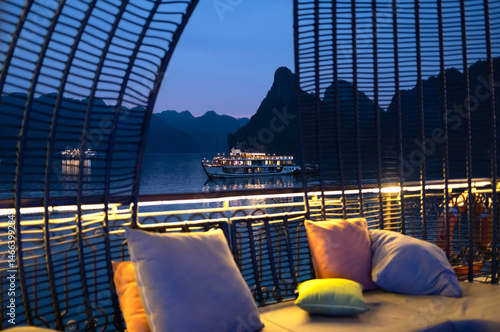 Night view of Halong Bay, Vietnam. Tourist cruise boats, staying overnight at Halong Bay in Vietnam