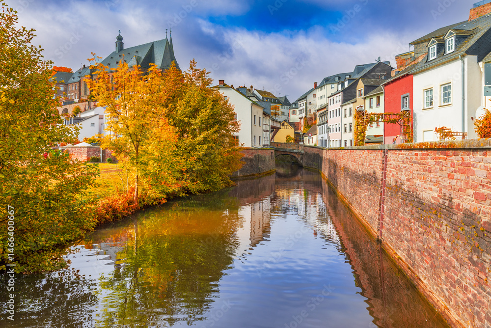Fototapeta premium Saarburg, Germany. Old town and Saar River reflection, autumn colors.