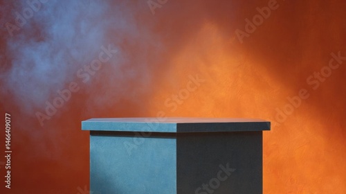 Rectangular table with a blue top and a black base. the table is placed against an orange background with a smoky haze or fog surrounding it.