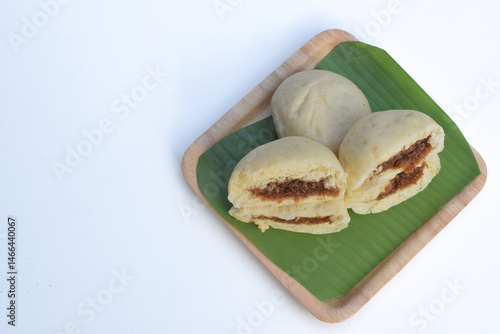 Baozi or bakpao is a Chinese Steamed Bread which is a type of yeast filled bun used in various Chinese dishes.