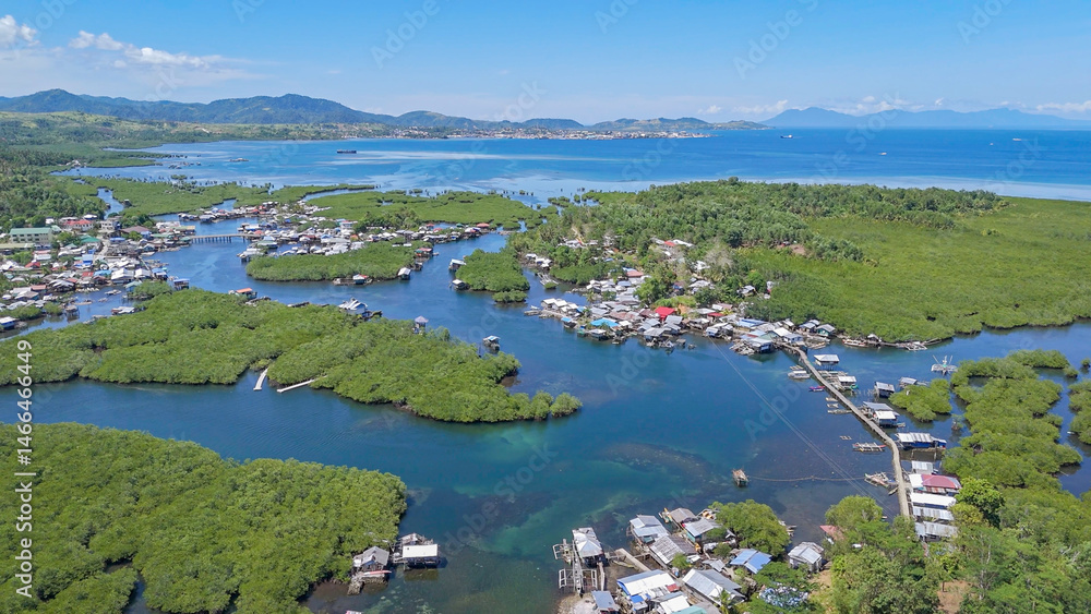 Fototapeta premium Day-Asan FLoating VIllage. Looking towards Surigao City, Philippines. 