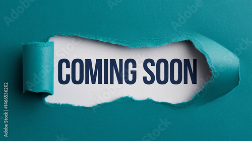 Torn teal paper reveals white background with 