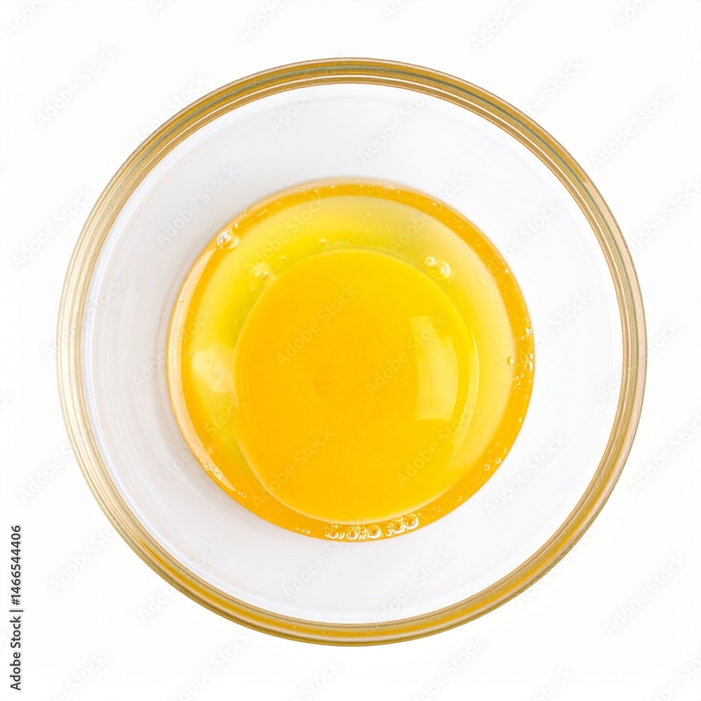 Glass Mixing Bowl with Whisked Egg on Isolated Background Glass Mixing Bowl with Whisked Egg on Isolated Background