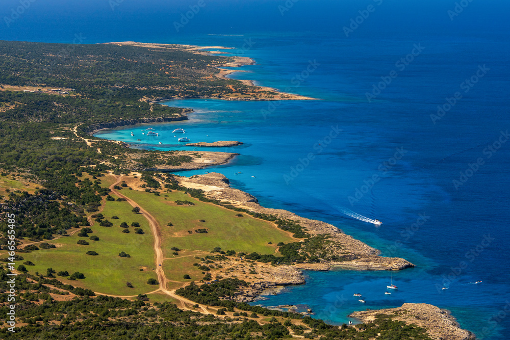 Fototapeta premium Picturesque aerial view of coastline at Fountain Amoros. Natural rock formations, clear waters create an atmosphere of secluded beauty. Travel, vacation