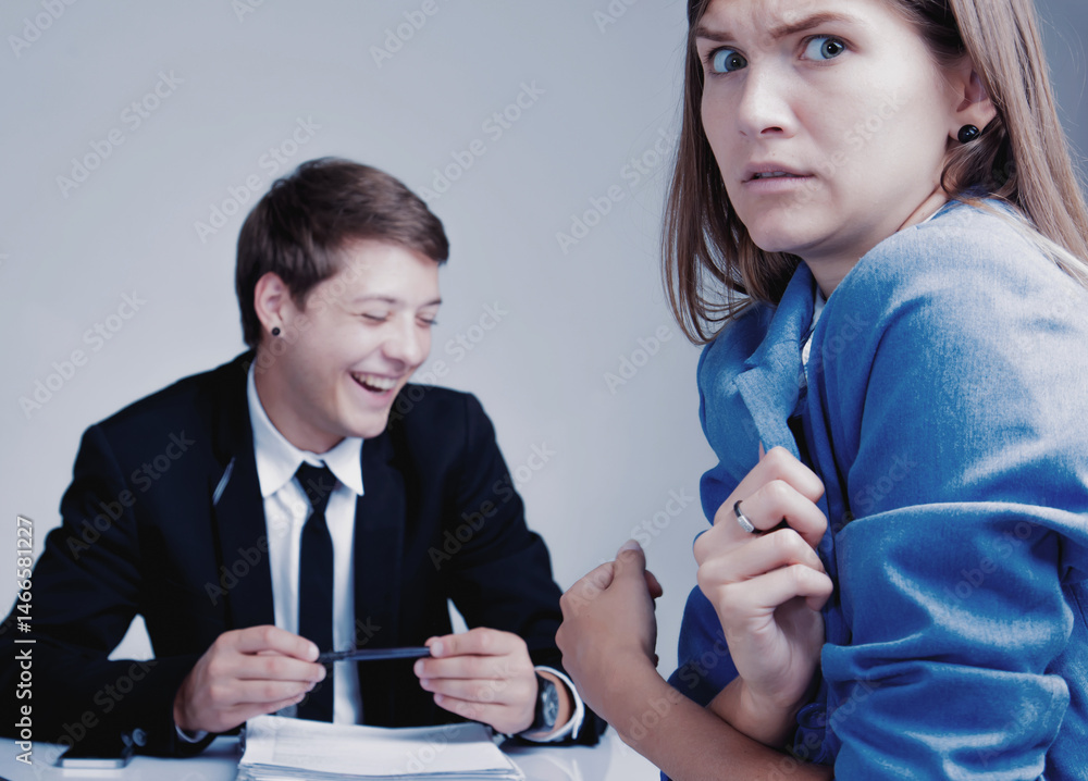The male businessbos laughing and ignoring his female worker. Latent aggression, competition, conflict, business concept Horizontal image.