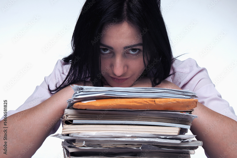 Alone working in office with a lot of documents. Horizontal image.