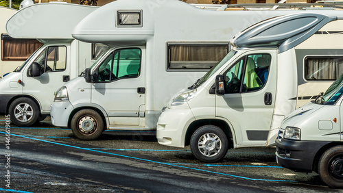 campers and motorhomes on asphatl parning, white auto caravan for  vacation travel