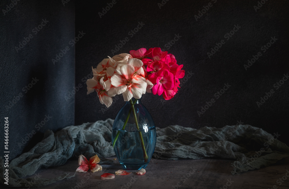Fototapeta premium Still life with a small bouquet of blooming geraniums.