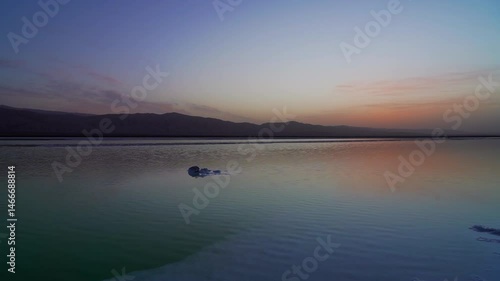 Experience the tranquil morning light over Mangya Emerald Lake in Haixi