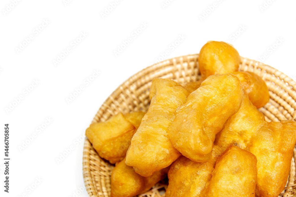 Deep-fried dough sticks in a woven basket Deep-fried dough sticks in a woven basket