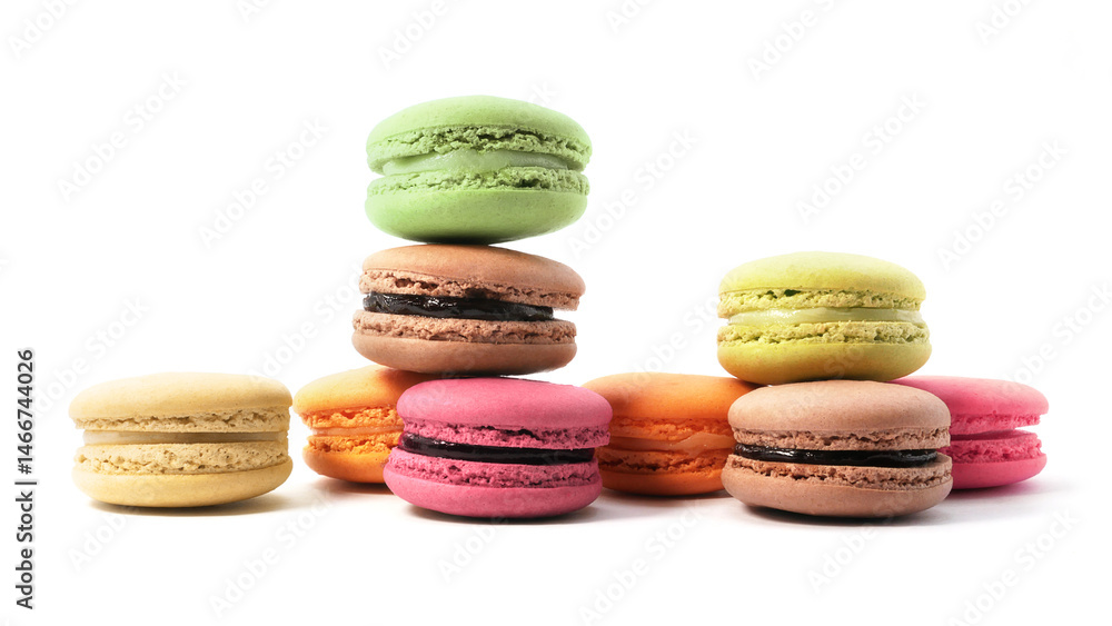 Pile of macaron cookies in various flavours and colours isolated on white background. Pile of macaron cookies in various flavours and colours isolated on white background.