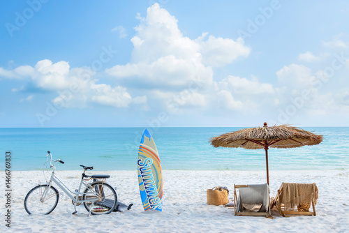 Fototapeta Naklejka Na Ścianę i Meble -  beautiful tranquil white sand beach with two beach chair and thatched umbrella with surfboard. romantic summer vacation at tropical private island for luxury sea resort advertising background.
