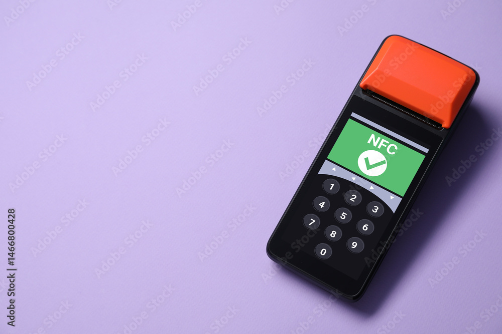 Payment terminal with NFC system on pale purple background, top view. Space for text Payment terminal with NFC system on pale purple background, top view. Space for text