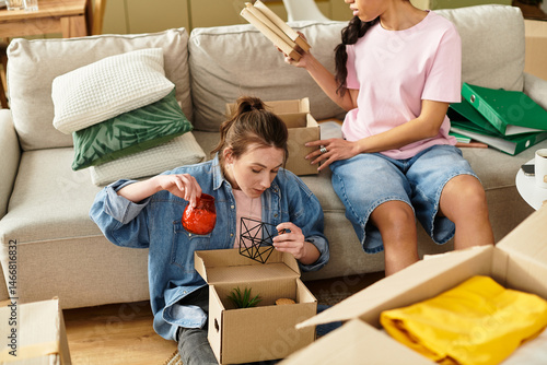 Fotografi Loving couple enjoys quality time while unpacking their new home together