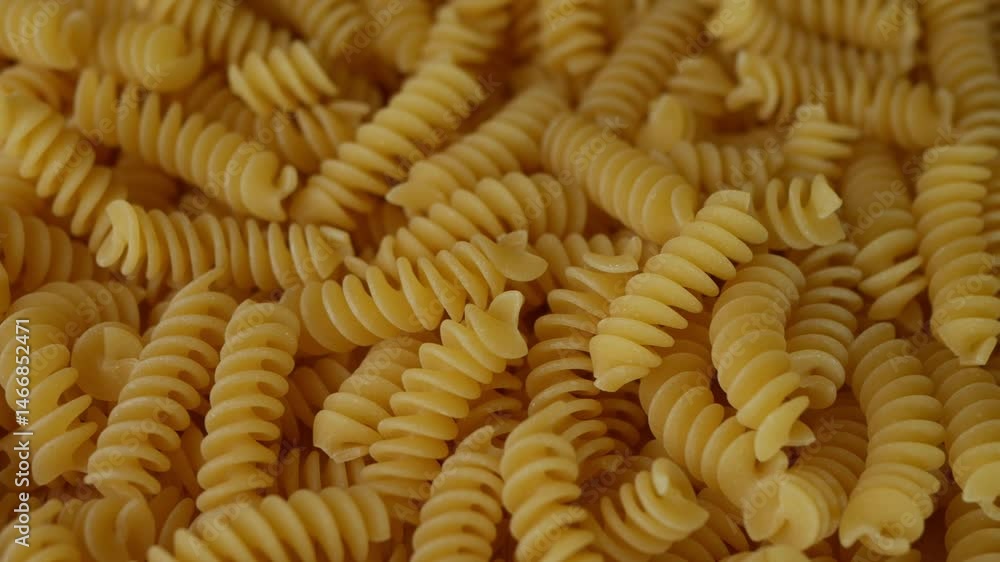 Raw Fusilli Spiral spaghetti pasta pattern background. Raw Fusilli Spiral spaghetti pasta pattern background.