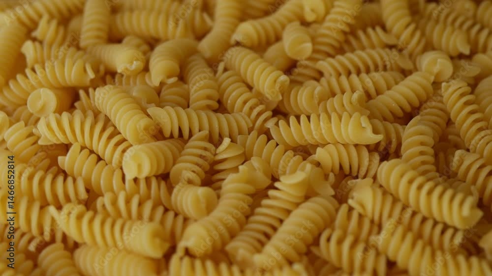 Raw Fusilli Spiral spaghetti pasta pattern background. Raw Fusilli Spiral spaghetti pasta pattern background.