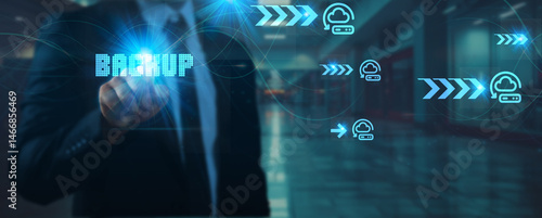 Businessman touches one technology point in their hand network connection on backup solutions, cloud storage, data recovery, disaster management, cybersecurity, technology, and futuristic systems.