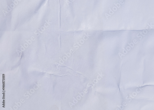 Distressed white paper with layered wrinkles and glue remnants, perfect for a vintage backdrop.