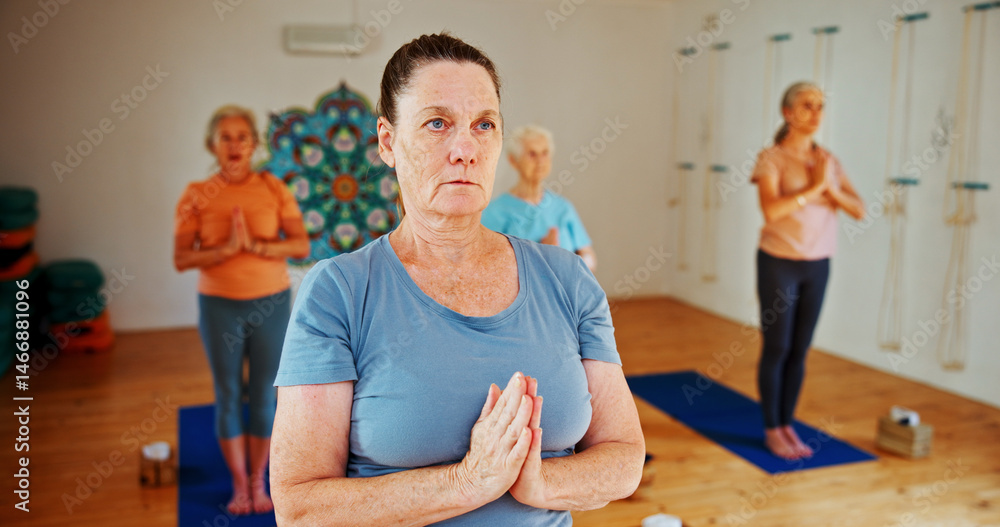 Fototapeta premium Breathing, namaste and women in meditation class for calm mindset, zen or peace in mental wellness. Posture, morning and mature people in group together for mindfulness, relax or holistic self care.