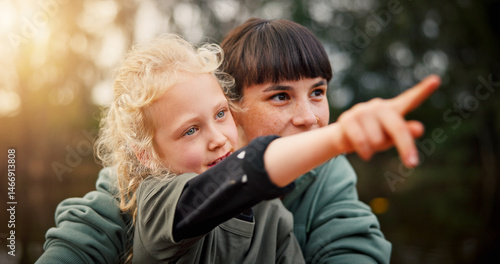 Mom, child and pointing with nature for sightseeing adventure, journey or bird watching in forest. Mother, parent or girl kid showing with finger for look, indication or outdoor bonding at park
