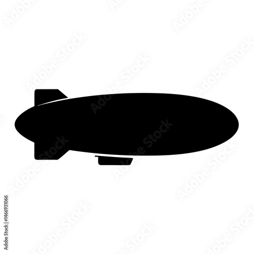 Silhouette of a black blimp or airship floating in the sky