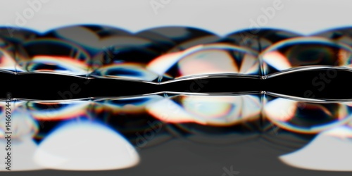 Fototapeta Naklejka Na Ścianę i Meble -  A row of smooth, abstract glass forms reflects colorful HDRI lighting, creating a wave-like pattern across a dark central divide. The image blends symmetry, light dispersion, and minimalism.