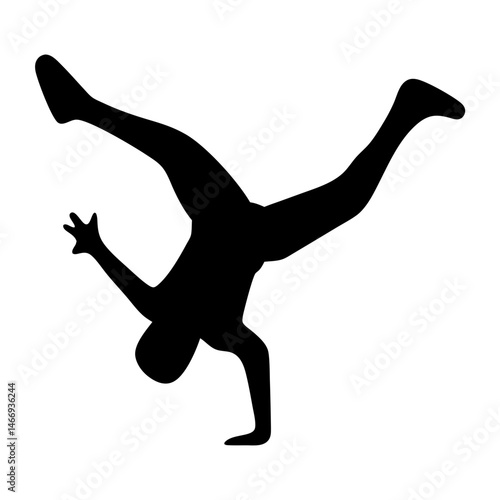 Silhouette of a breakdancer in motion performing a complex acrobatic move
