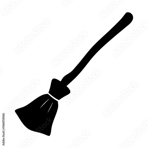 Black silhouette of a witch's broom used during Halloween season.