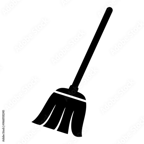 Black and white broom with a stick for sweeping the floor