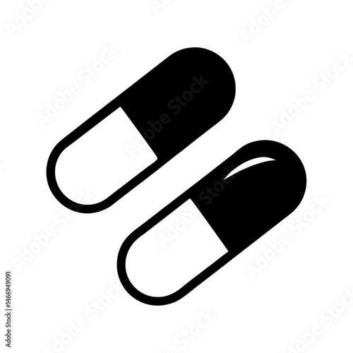 Two pharmaceutical pills in black and white, isolated on a white background