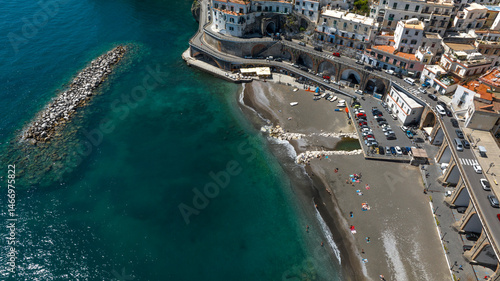 Aerial view of the beach of Atrani in the province of Salerno, Campania, Italy. It is one of the most beautiful and touristic places on the Amalfi coast, overlooking the Mediterranean Sea.