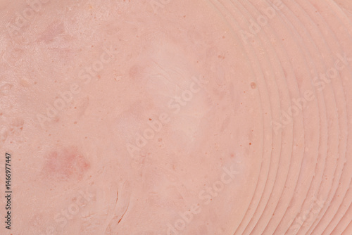 Obraz na płótnie A close-up shot of a stack of thinly sliced chicken breast deli meat w salonie