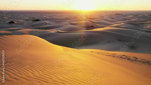 Golden sunset over desert dunes captured in three stunning views