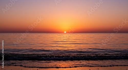 Beautiful sunrise over the calm ocean water