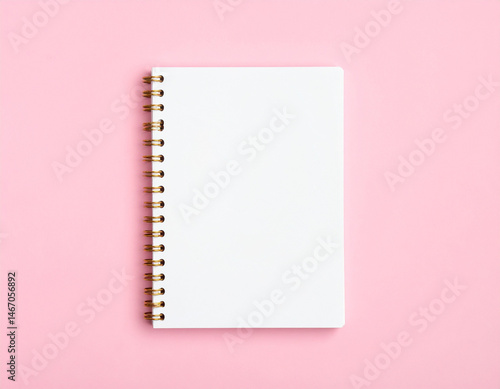 Blank white notebook mockup with gold spiral binding